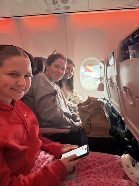 Chad and his family seated together on a Southwest flight